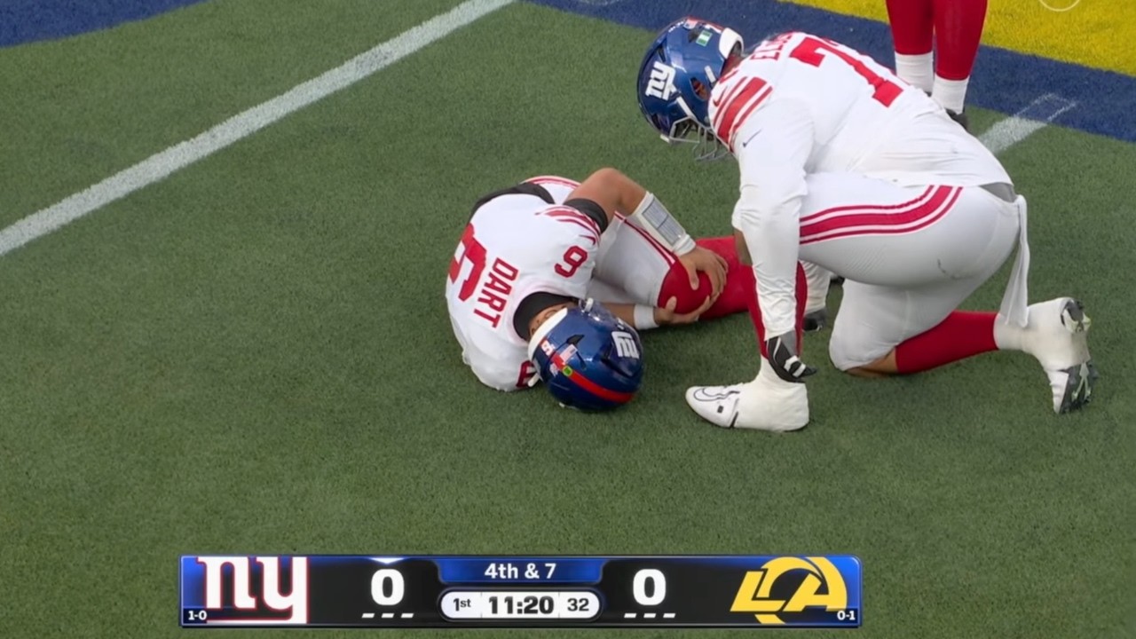 Jaxson Dart on the field after suffering a knee injury against the Los Angeles Rams